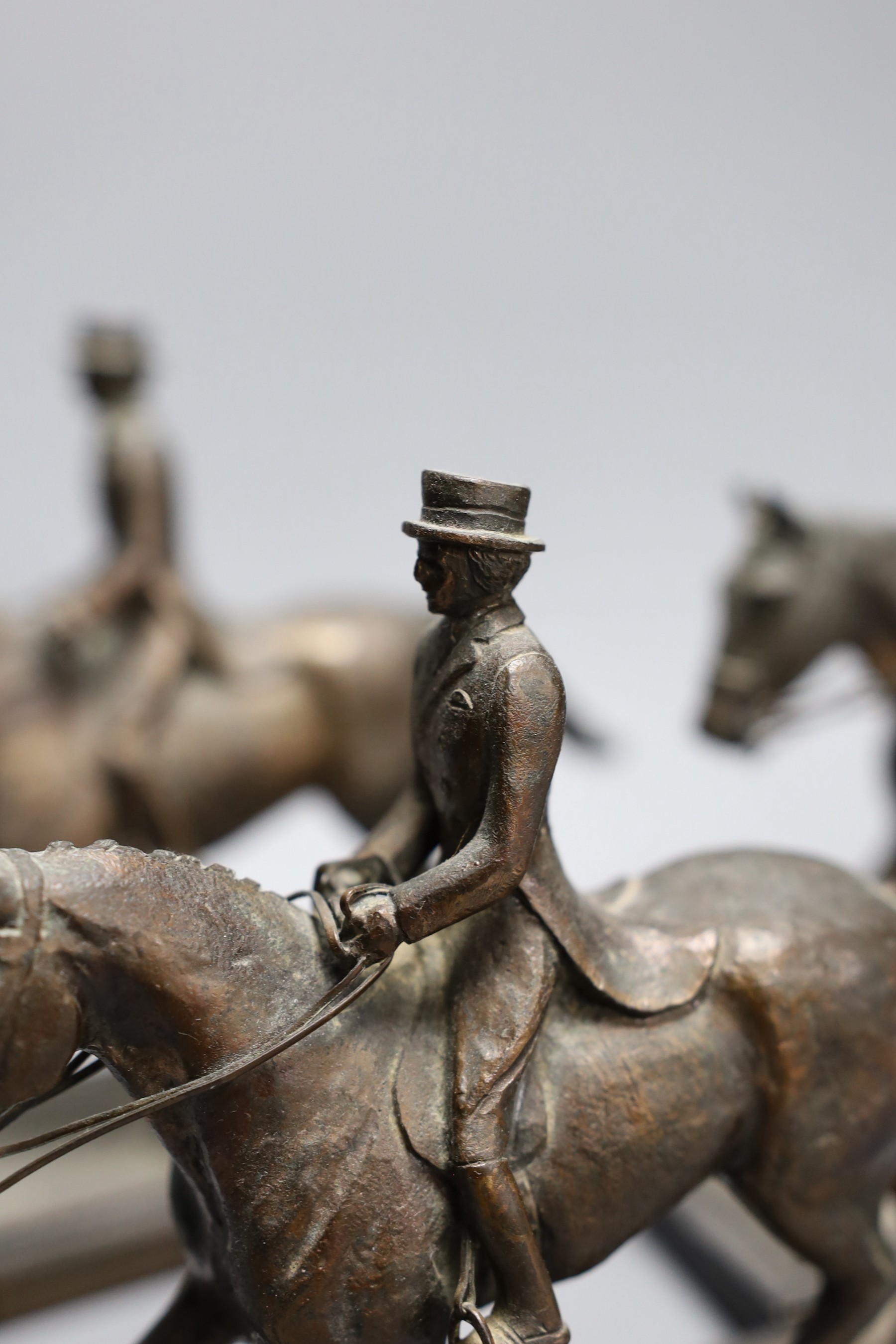 Five bronze spelter models of dressage horse and rider awarded to Domini Lawrence c.1970s, 15cm tall